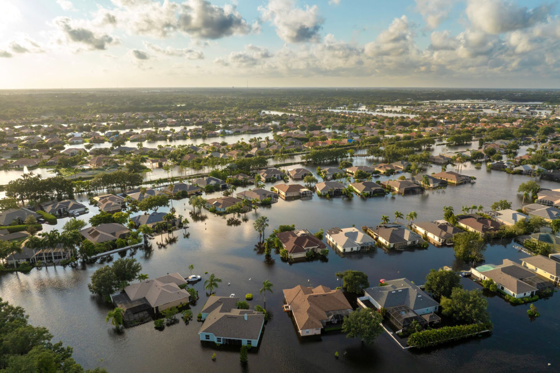 Flooding in Florida caused by tropical storm from hurricane Debby. Suburb houses in Laurel Meadows residential community surrounded by flood waters in Sarasota. Aftermath of natural disaster.